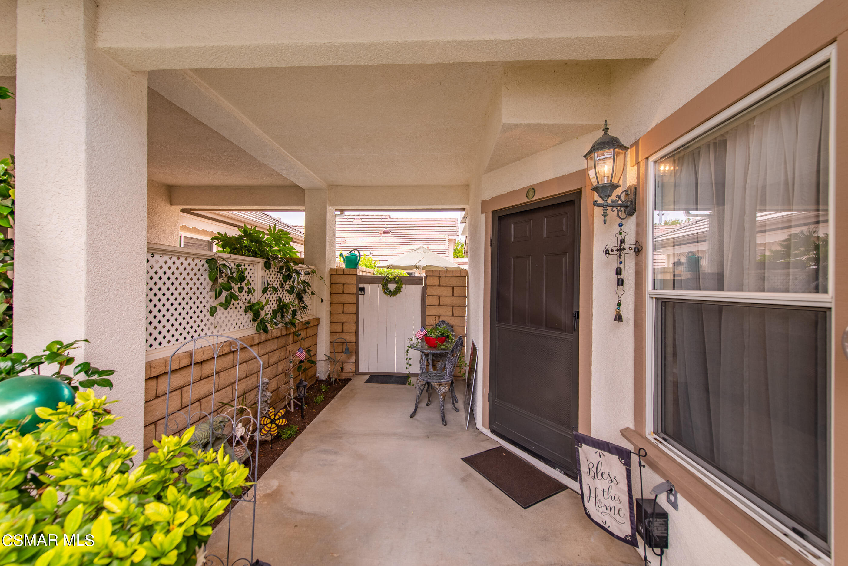 5642 Daisy Street Simi Valley, CA 93063 - Photo 4 of 41 a hallway with beautiful frames and flower vase