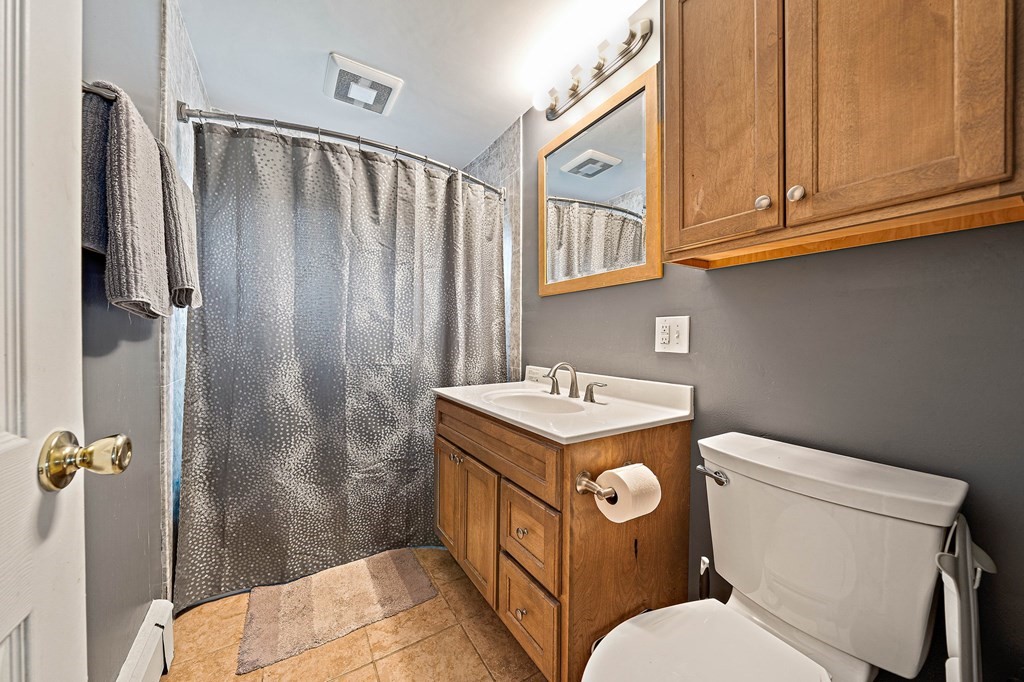 35 Will Drive, Unit 3 Canton, MA 02021 - Photo 13 of 18 a bathroom with a sink a toilet and shower