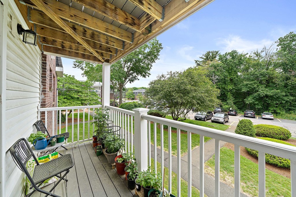 35 Will Drive, Unit 3 Canton, MA 02021 - Photo 14 of 18 a view of a chair and table in the balcony
