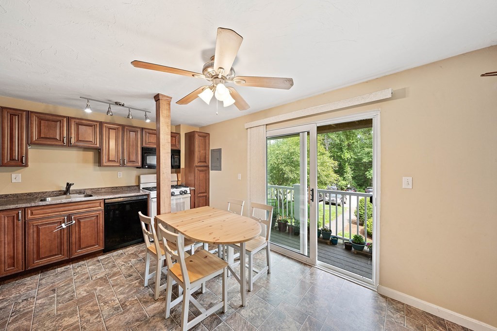 35 Will Drive, Unit 3 Canton, MA 02021 - Photo 2 of 18 a view of a dining room with furniture window and wooden floor