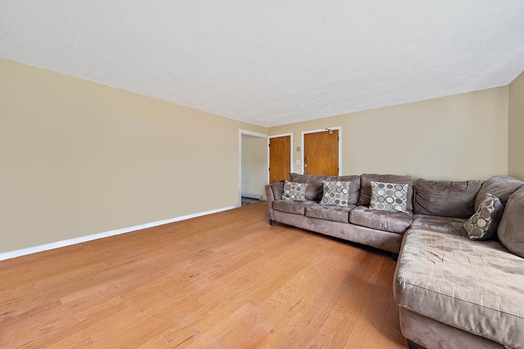 35 Will Drive, Unit 3 Canton, MA 02021 - Photo 7 of 18 a living room with a couch