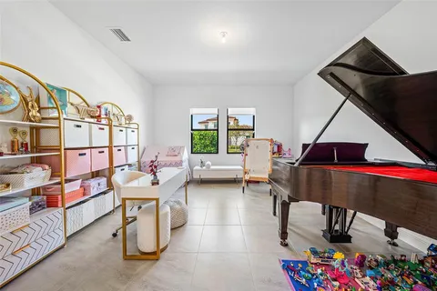 a living room with furniture a rug and a window