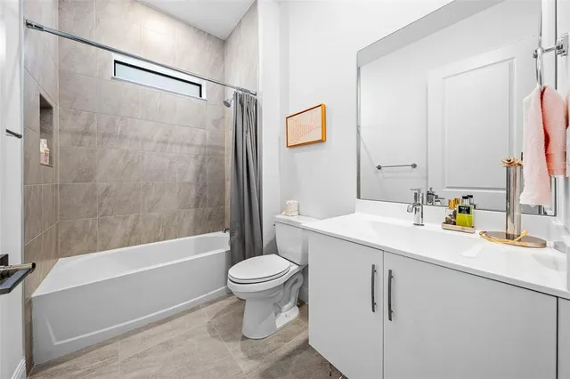 a bathroom with a sink a toilet and a bathtub