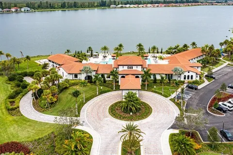 a view of a swimming pool with a table and chairs