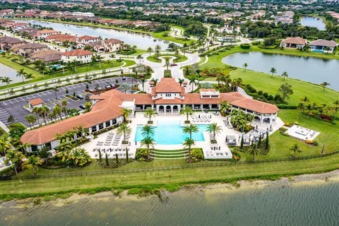 a view of a swimming pool with a patio and a garden