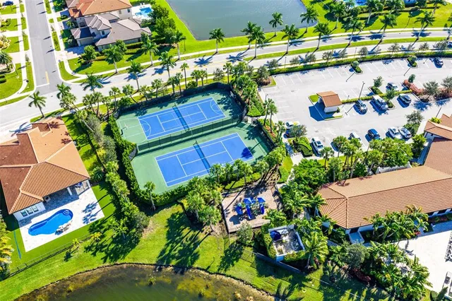 a view of a swimming pool with a yard