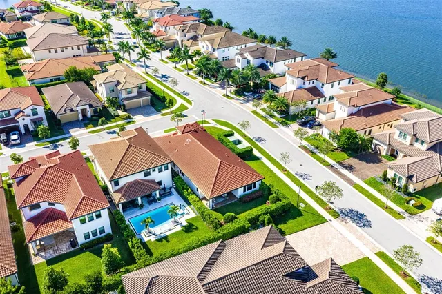 an aerial view of residential houses with outdoor space