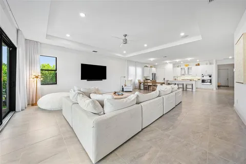 a living room with couches and a flat screen tv
