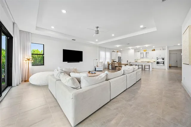 a living room with couches and a flat screen tv