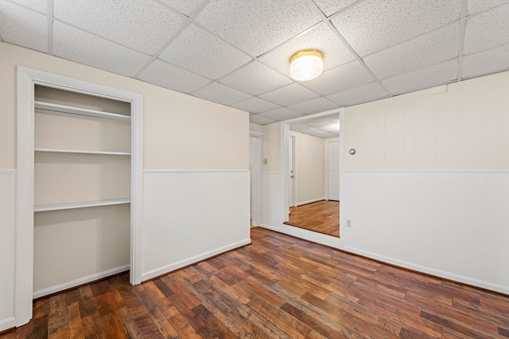 98 Main Street, Unit V Andover, MA 01810 - Photo 17 of 21 a view of an empty room and wooden floor
