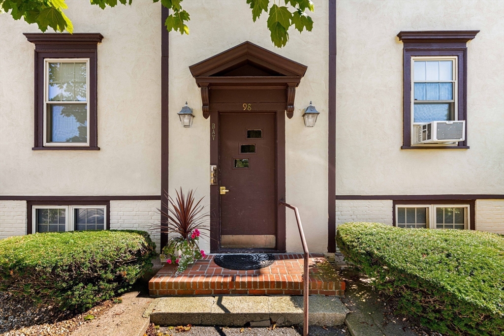 98 Main Street, Unit V Andover, MA 01810 - Photo 3 of 21 a front view of a house with a yard