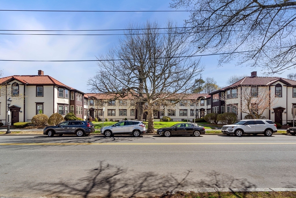 98 Main Street, Unit V Andover, MA 01810 - Photo 4 of 21 a cars parked in front of a building