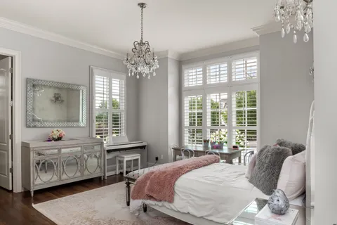a bedroom with a bed and a table