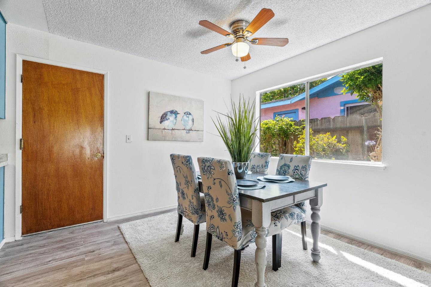 742 Pino Way Salinas, CA 93905 - Photo 8 of 30 a view of a dining room with furniture and a potted plant