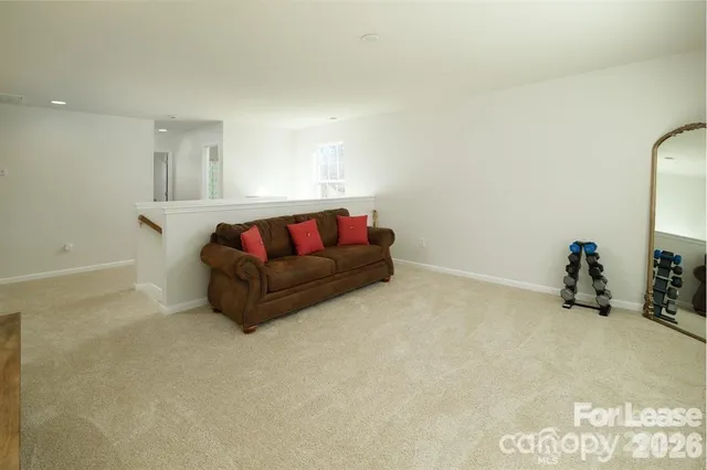 a living room with furniture and a couch