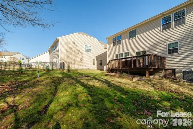 a balcony with wooden floor and furniture