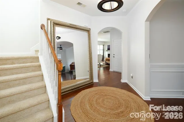 a view of entryway with wooden floor