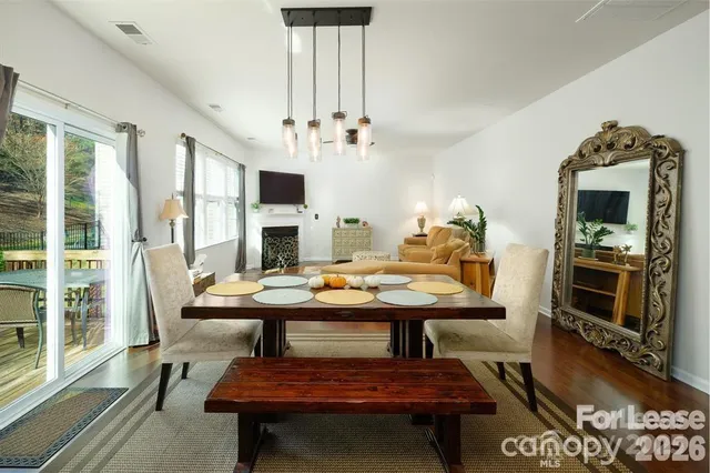 a view of a livingroom with furniture and a fireplace
