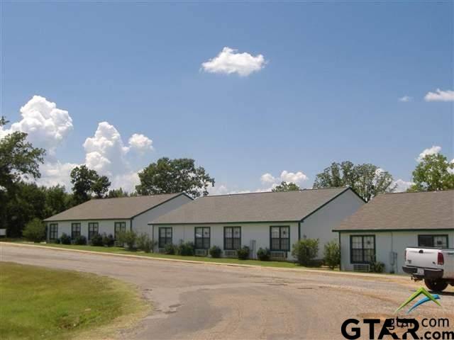 Lot 107-108 Concho Quitman, TX 75783 - Photo 12 of 14 a front view of a house with a yard and a garage