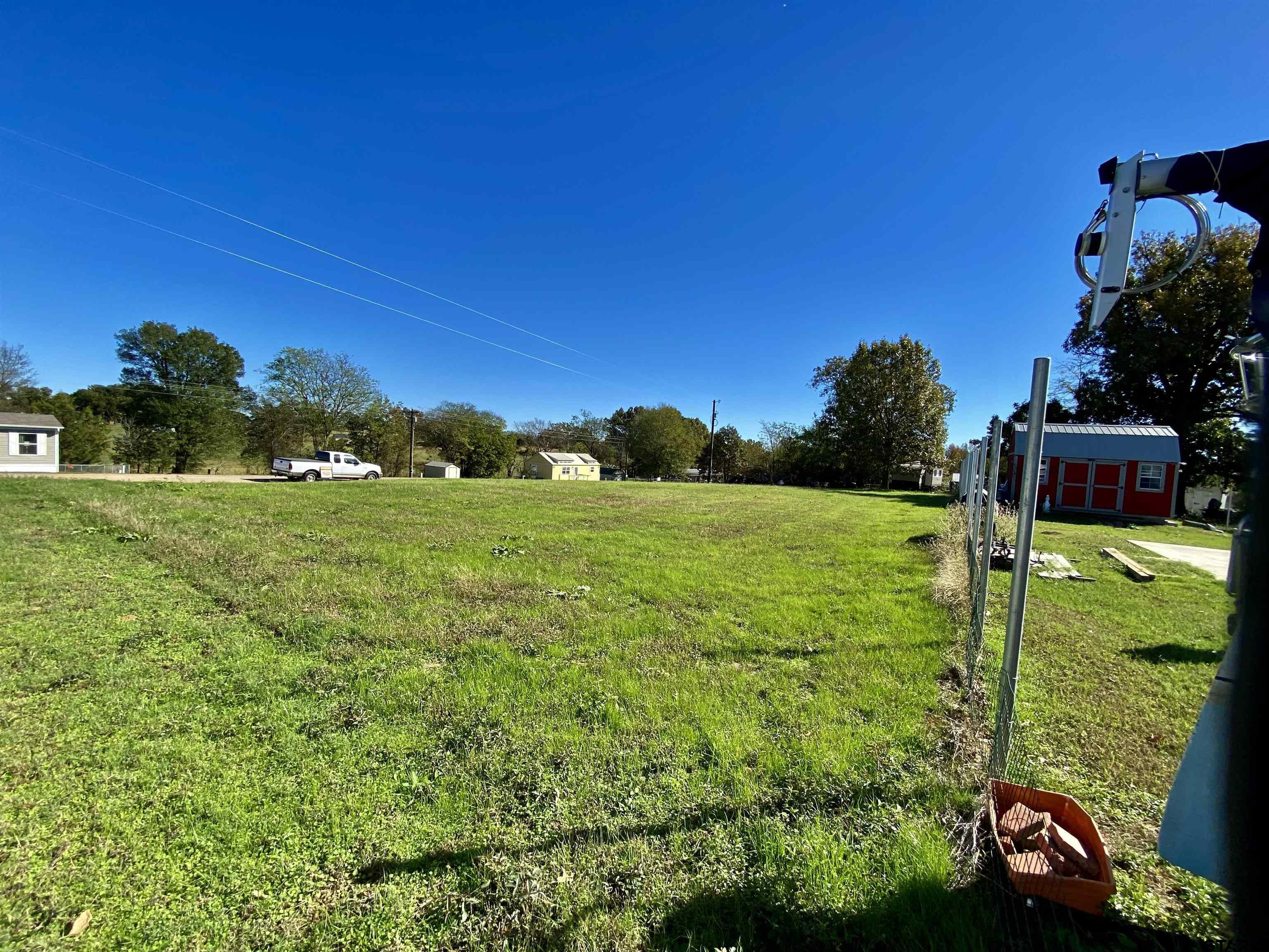 Lot 107-108 Concho Quitman, TX 75783 - Photo 5 of 14 a view of a garden with a building in the background