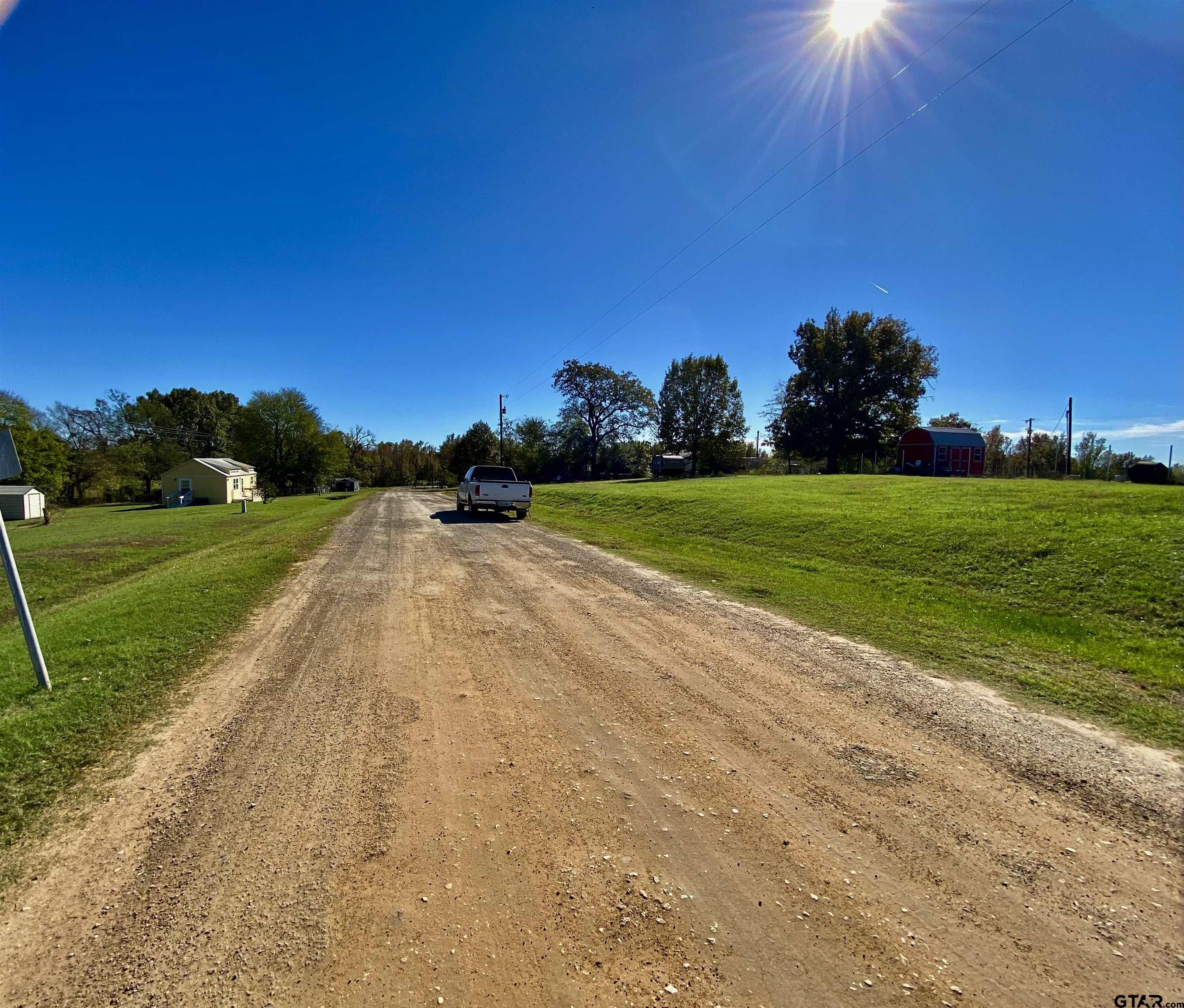Lot 107-108 Concho Quitman, TX 75783 - Photo 7 of 14 a view of a grassy field with an trees
