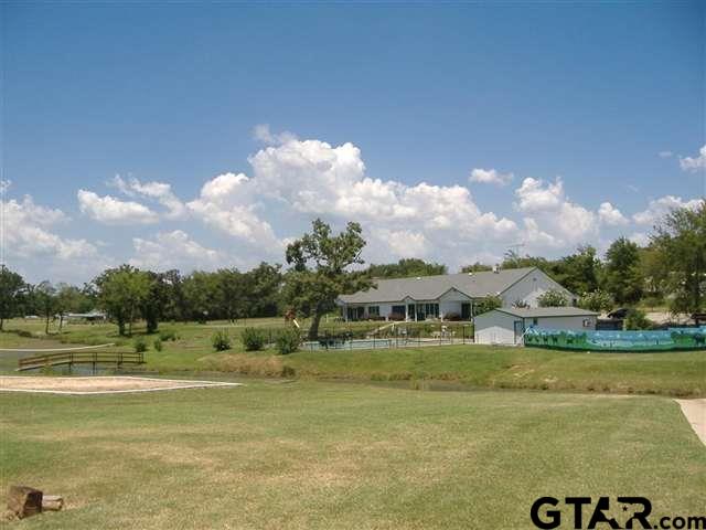 Lot 107-108 Concho Quitman, TX 75783 - Photo 9 of 14 a view of a lake with houses in the back