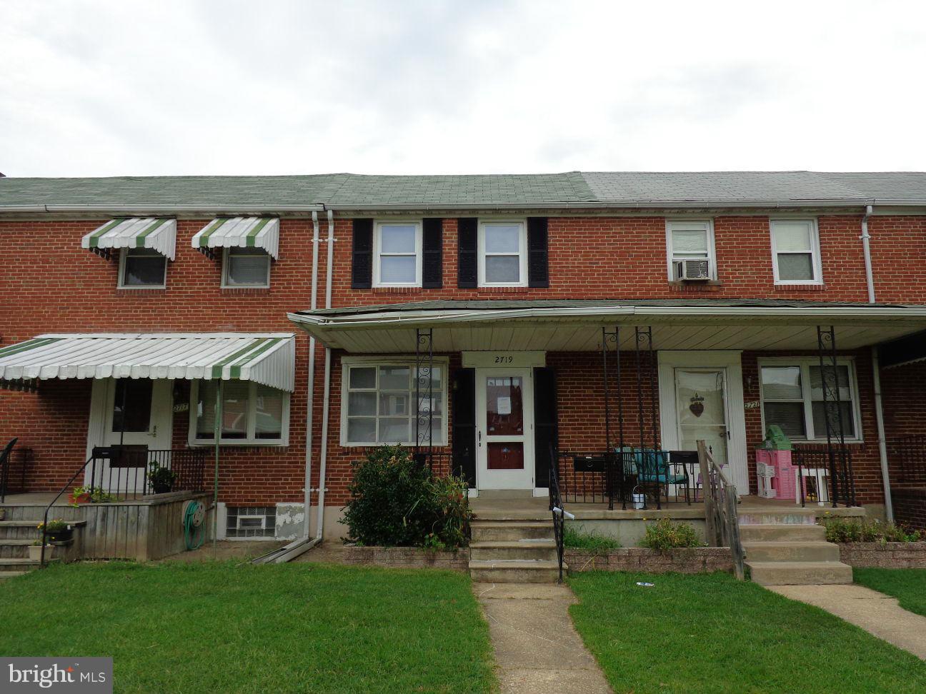 2719 Southbrook Road Dundalk, MD 21222 - Photo 1 of 18 a front view of a residential apartment building with a yard