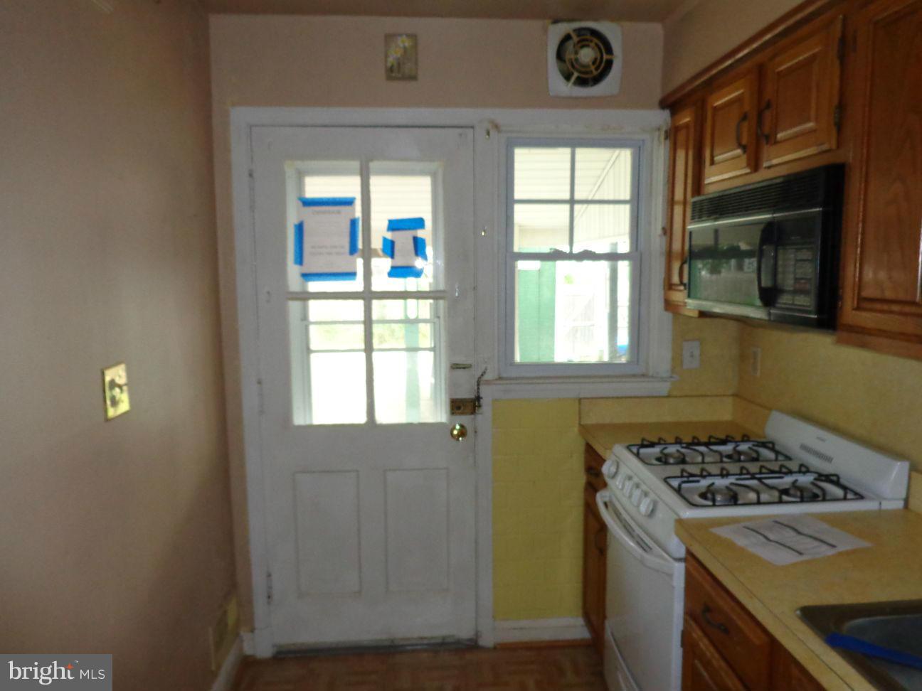 2719 Southbrook Road Dundalk, MD 21222 - Photo 2 of 18 a kitchen that has a lot of windows in it