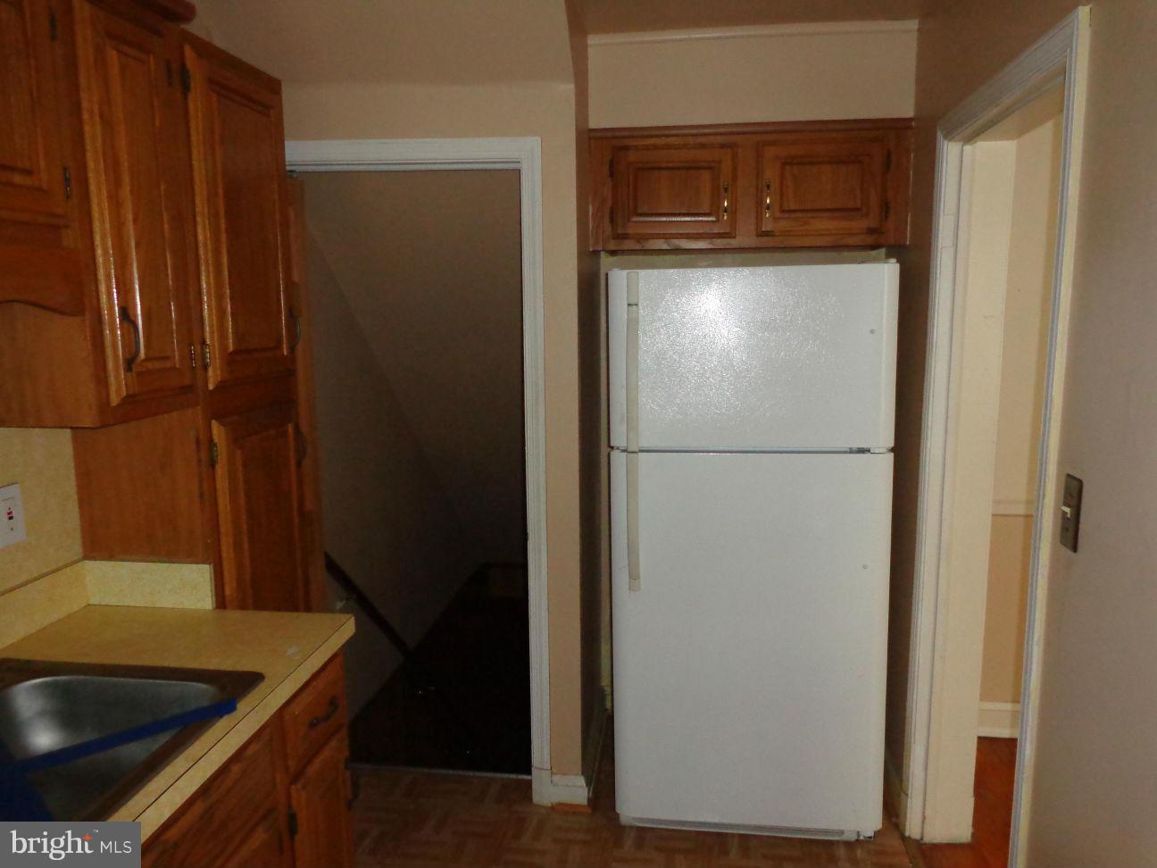2719 Southbrook Road Dundalk, MD 21222 - Photo 3 of 18 a kitchen with metallic refrigerator freezer and a dishwasher