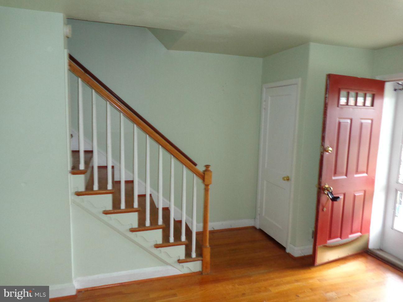 2719 Southbrook Road Dundalk, MD 21222 - Photo 5 of 18 a view of a hallway with wooden floor and staircase
