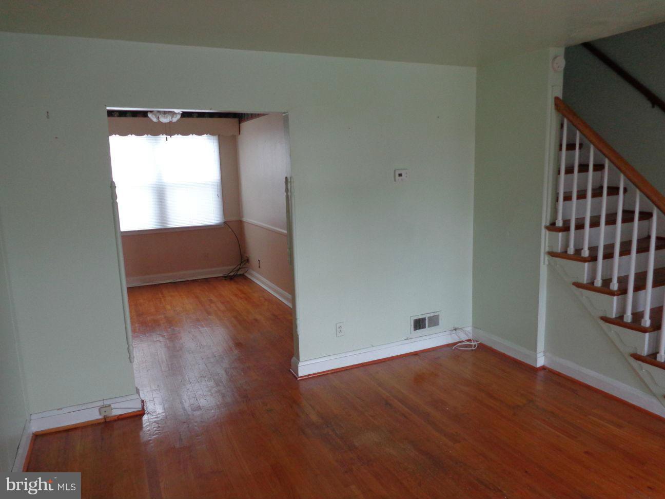2719 Southbrook Road Dundalk, MD 21222 - Photo 6 of 18 wooden floor in an empty room with a window