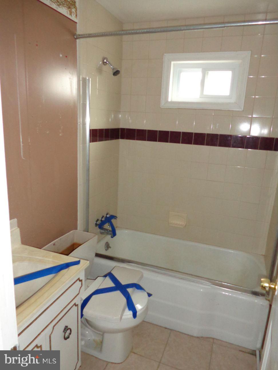 2719 Southbrook Road Dundalk, MD 21222 - Photo 10 of 18 a bathroom with a sink and a mirror