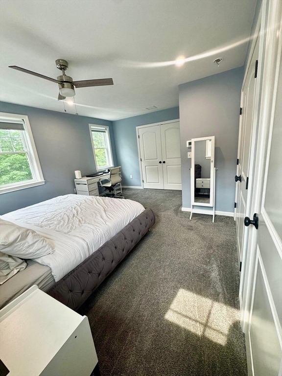 11 Millies Way, Unit 11 Sterling, MA 01564 - Photo 12 of 28 a bedroom with a bed and a walk in closet