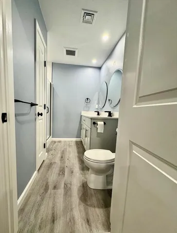a bathroom with a toilet and a sink