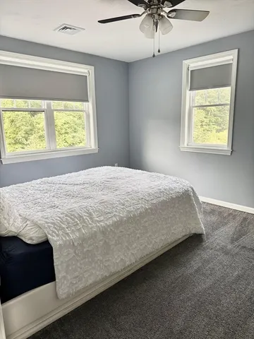 a bathroom with a sink toilet and mirror