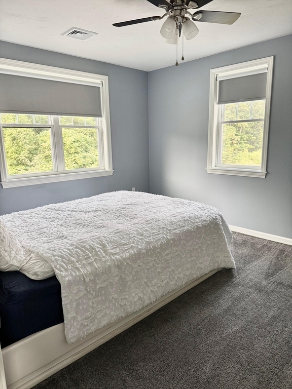 11 Millies Way, Unit 11 Sterling, MA 01564 - Photo 17 of 28 a bedroom with a bed and window