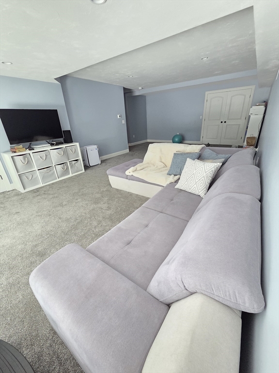 11 Millies Way, Unit 11 Sterling, MA 01564 - Photo 21 of 28 a bedroom with a bed and a couch