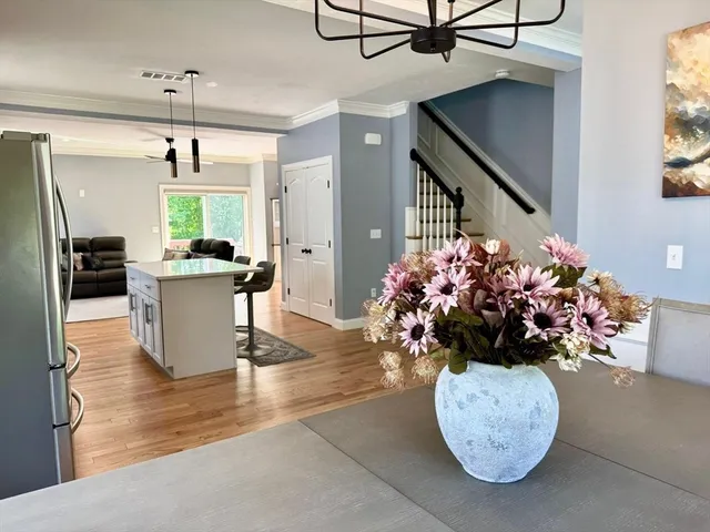 a view of a dining room with furniture window and wooden floor