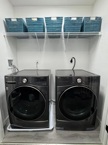 a utility room with dryer and washer