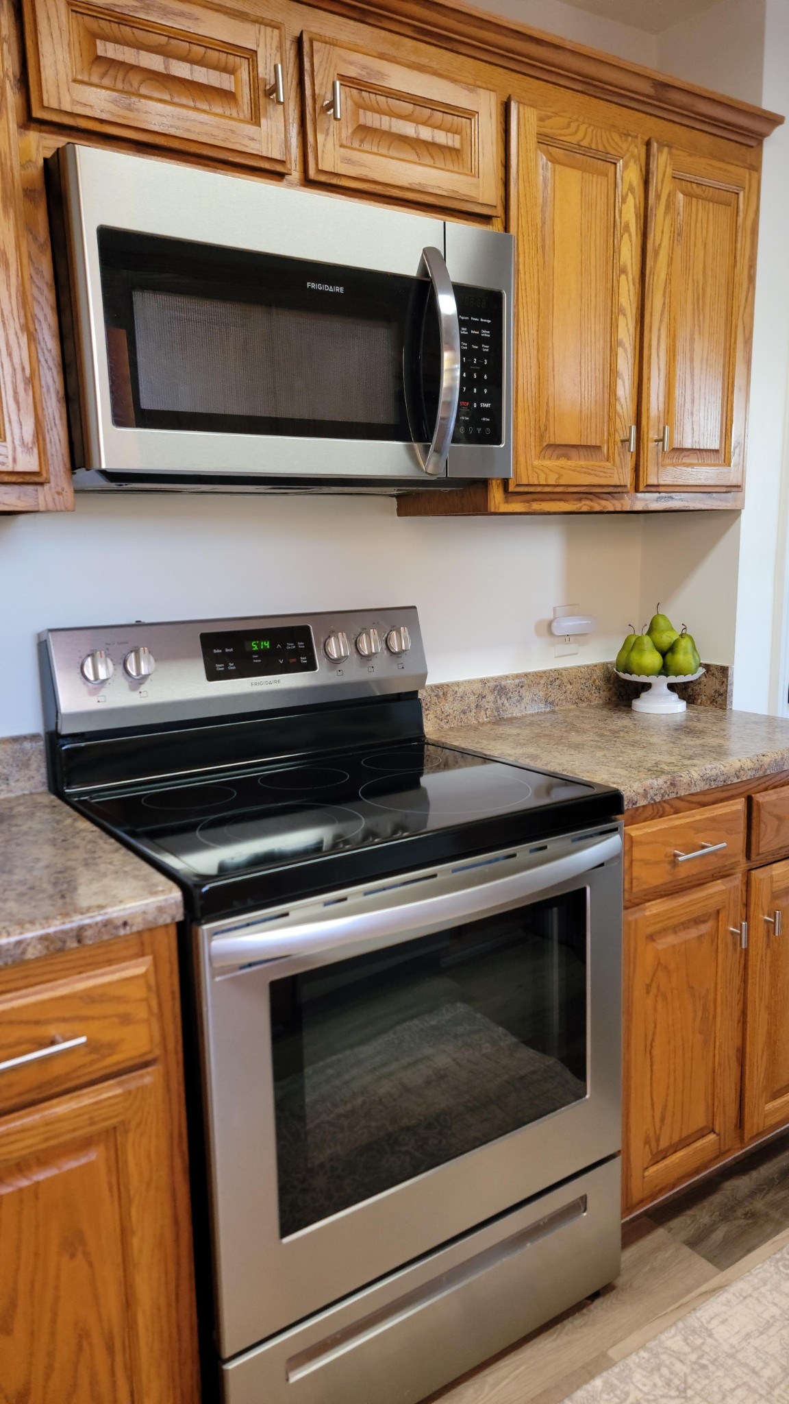 195 Rileys Bend Road Lynchburg, TN 37352 - Photo 16 of 32 a kitchen with stainless steel appliances granite countertop a stove microwave and oven
