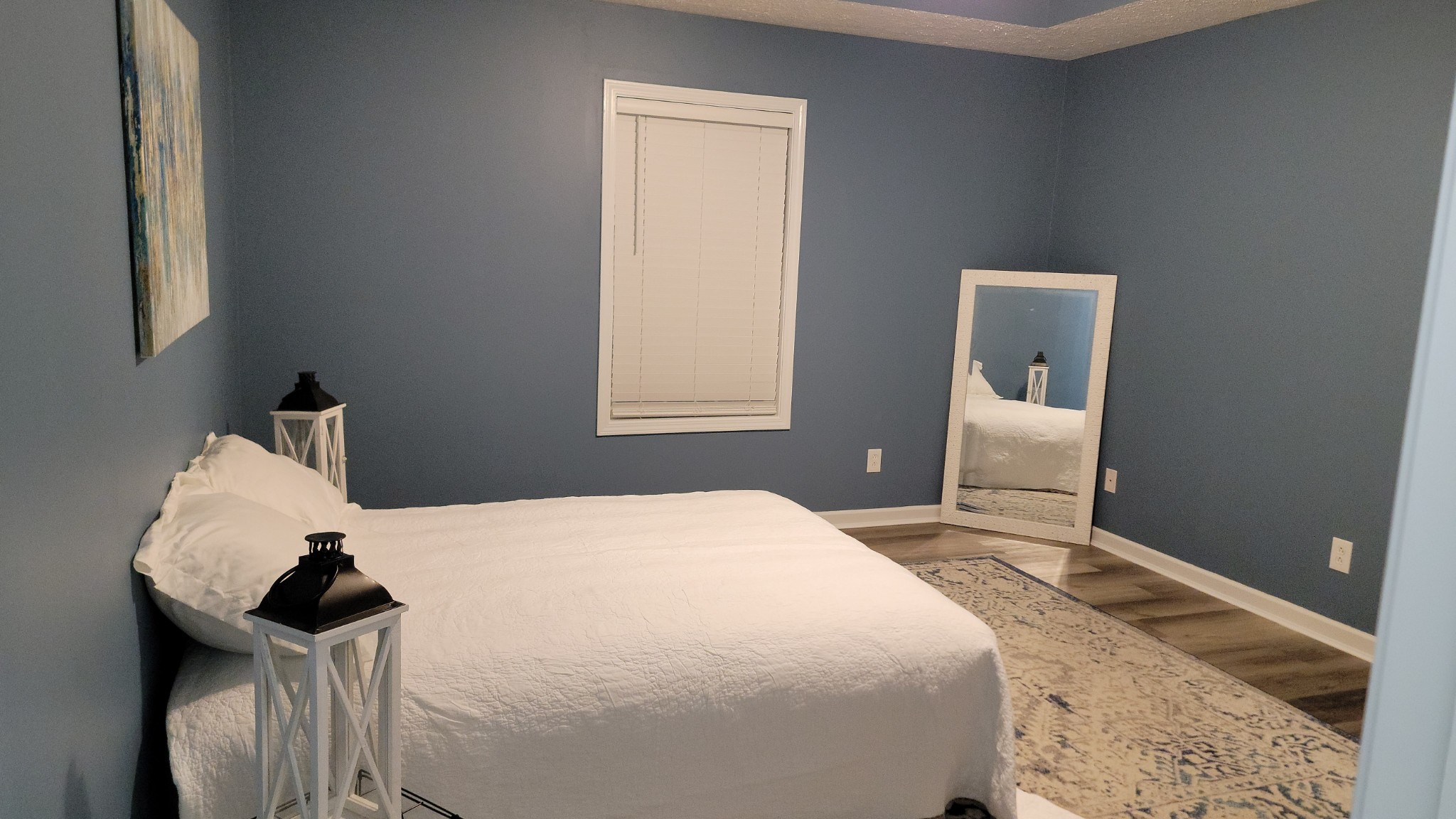 195 Rileys Bend Road Lynchburg, TN 37352 - Photo 24 of 32 a bedroom with a bed and wooden floor