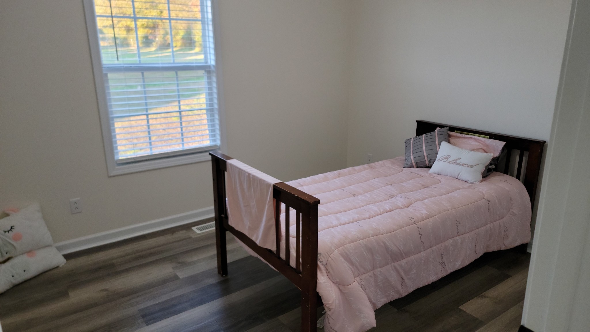 195 Rileys Bend Road Lynchburg, TN 37352 - Photo 5 of 32 a bed sitting in a bedroom next to a window