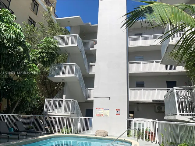 a front view of residential houses with street view