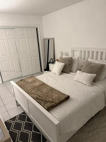 a living room with a rug and a rug