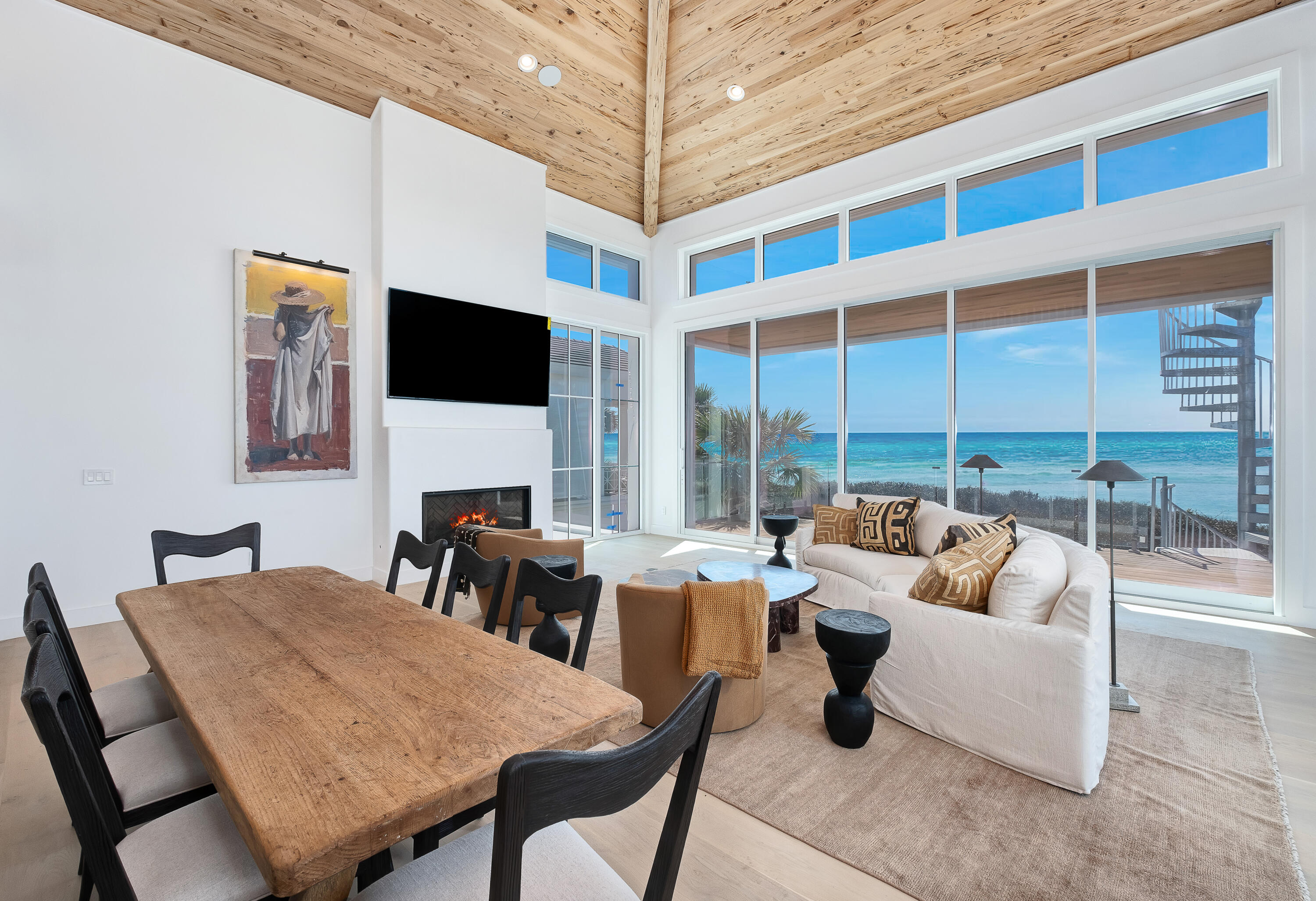 40 Jasmine Circle Santa Rosa Beach, FL 32459 - Photo 16 of 100 a living room with furniture a flat screen tv and a floor to ceiling window