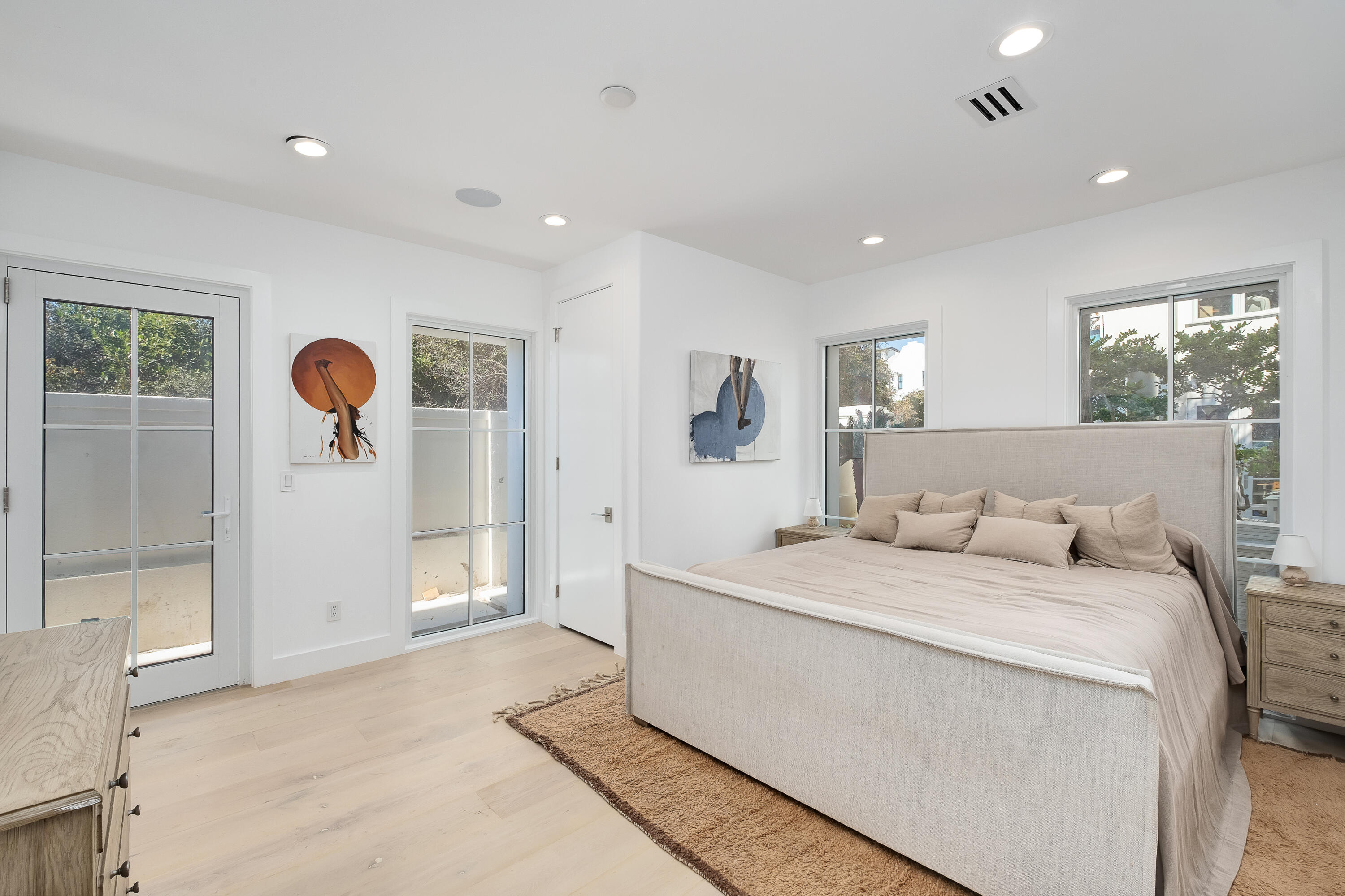 40 Jasmine Circle Santa Rosa Beach, FL 32459 - Photo 36 of 100 a spacious bedroom with a bed and a large mirror