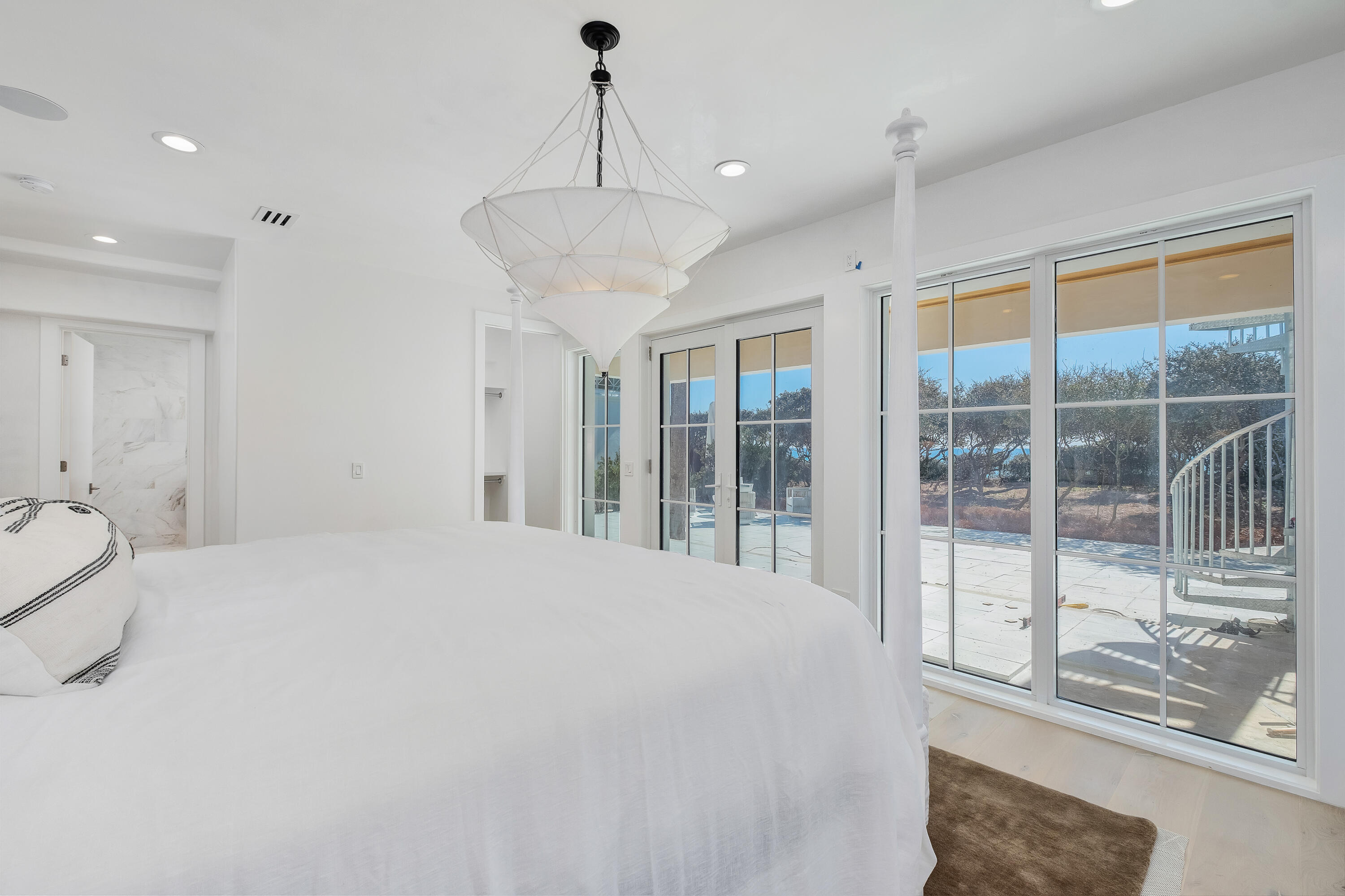 40 Jasmine Circle Santa Rosa Beach, FL 32459 - Photo 42 of 100 a large bedroom with a bed and glass door