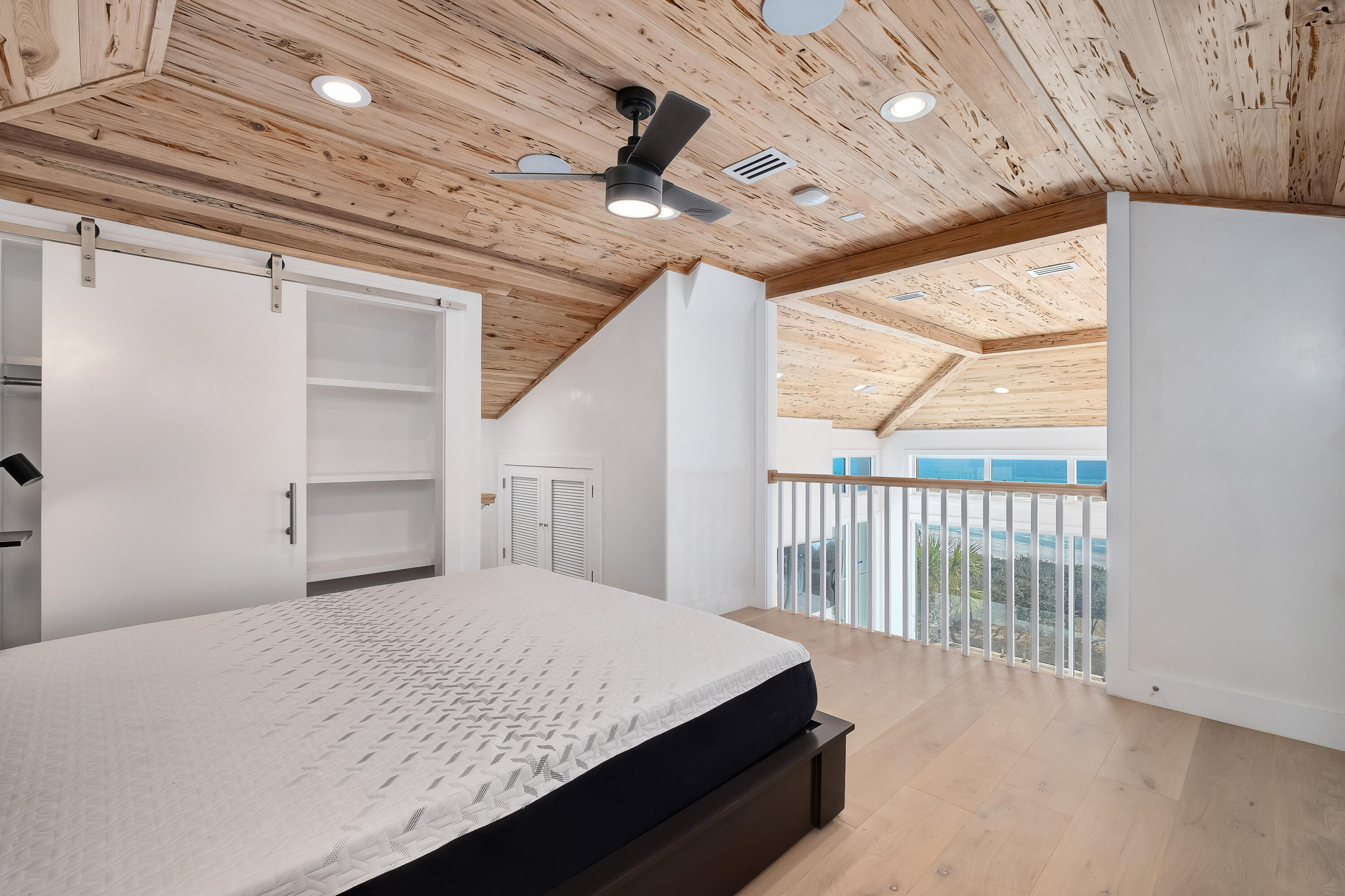 40 Jasmine Circle Santa Rosa Beach, FL 32459 - Photo 46 of 100 a bedroom with a large bed and a large window