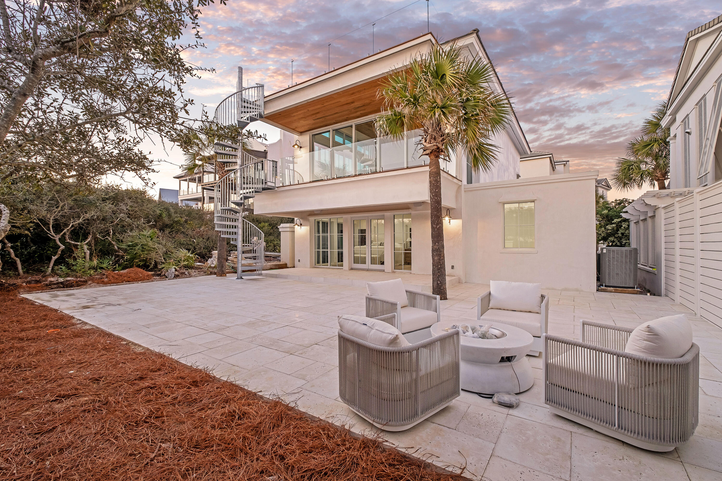 40 Jasmine Circle Santa Rosa Beach, FL 32459 - Photo 79 of 100 a view of a patio with couches table and chairs and potted plants