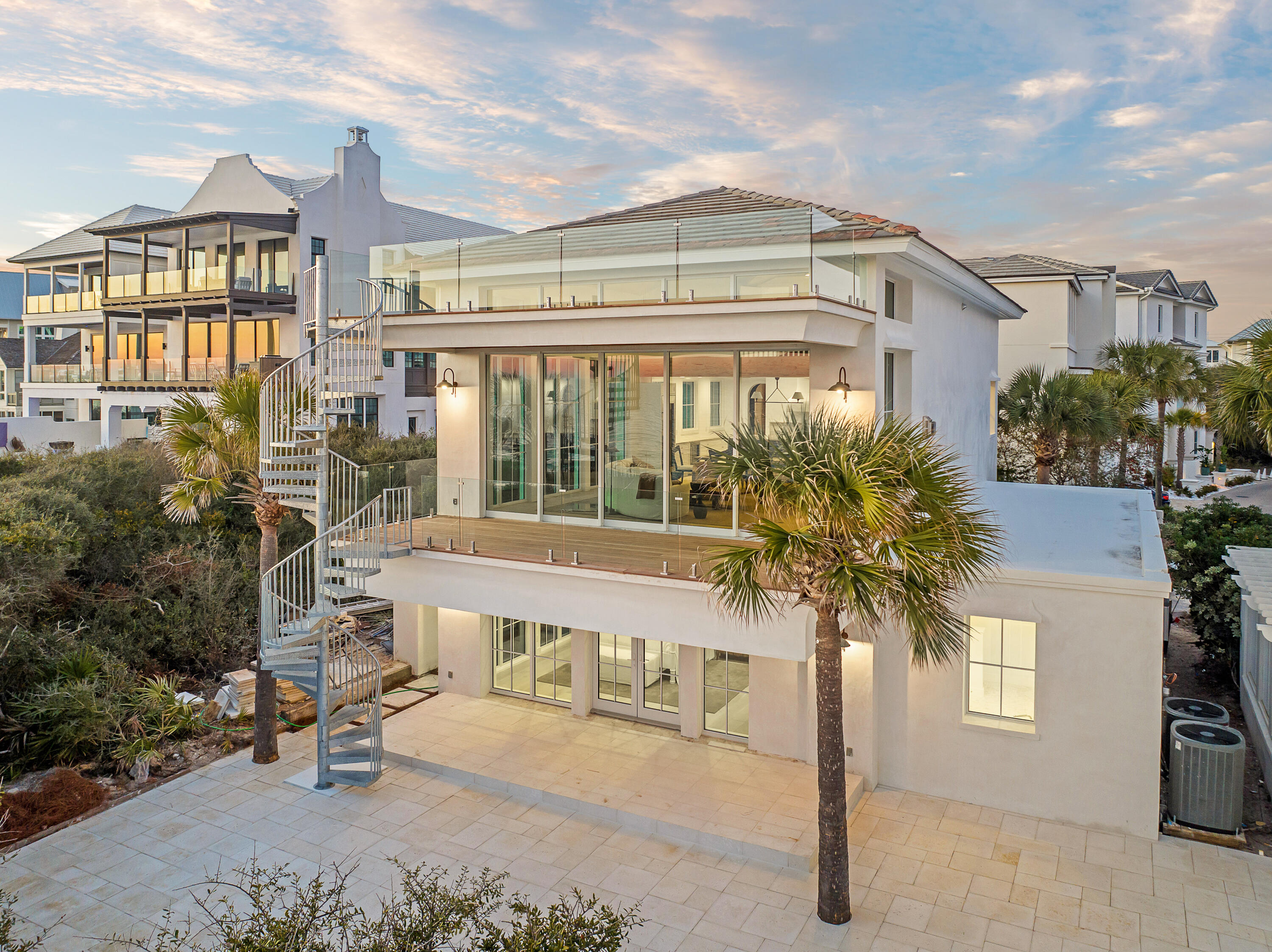 40 Jasmine Circle Santa Rosa Beach, FL 32459 - Photo 90 of 100 a front view of a building with a garden and plants